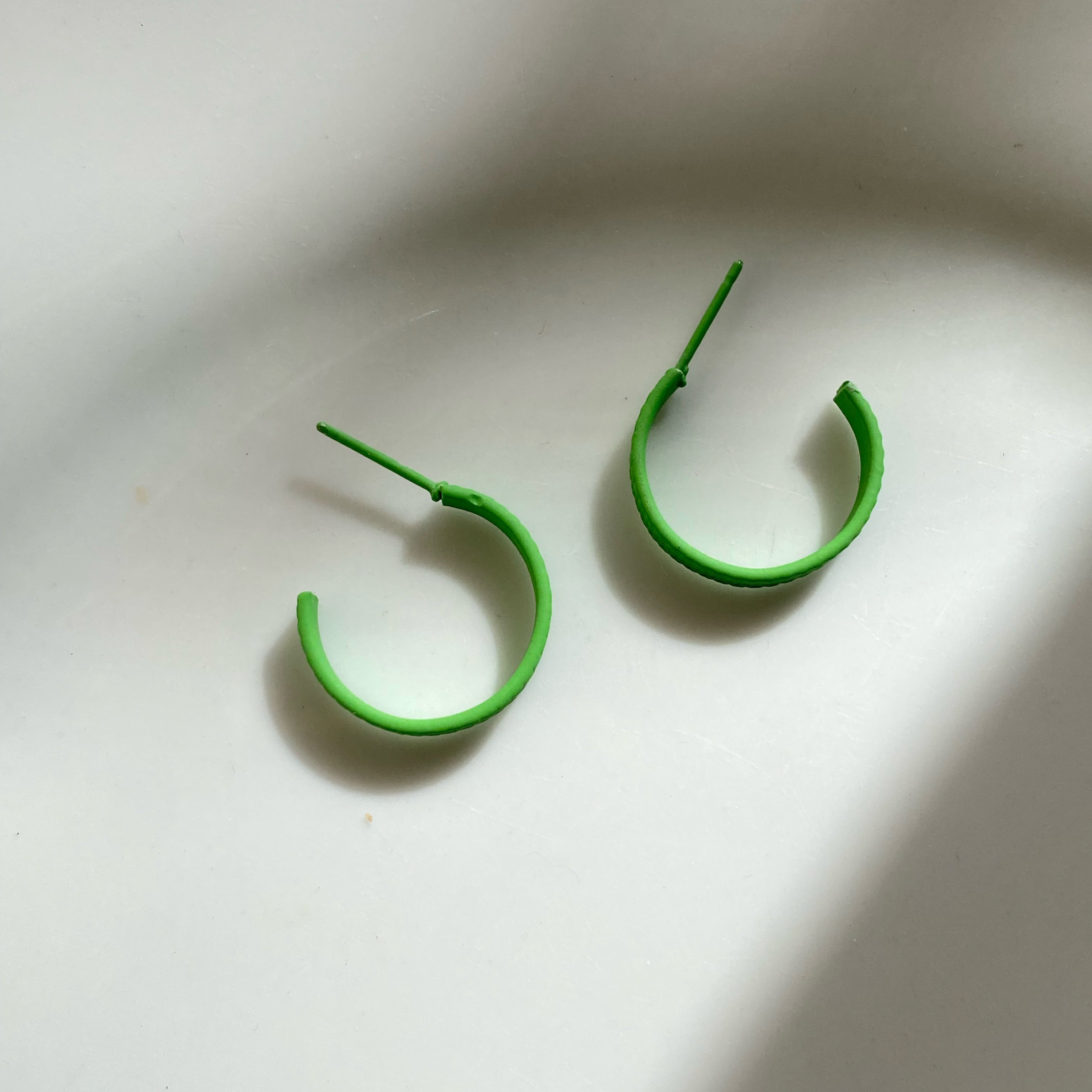 Green hoop earrings